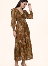 Model in a side pose wearing the Daisy Maxi Dress, emphasizing its flowy silhouette and vintage floral design. Great for handmade wardrobe additions.