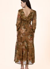 Back view of the Daisy Maxi Dress displaying the deep V-back, ruffled details, and tiered skirt. A must-have sewing pattern for elegant dresses.