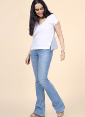 Model wearing a white V-neck relaxed top with a striped back panel, made using the Winslet's sewing pattern. Casual and comfortable design for everyday wear.