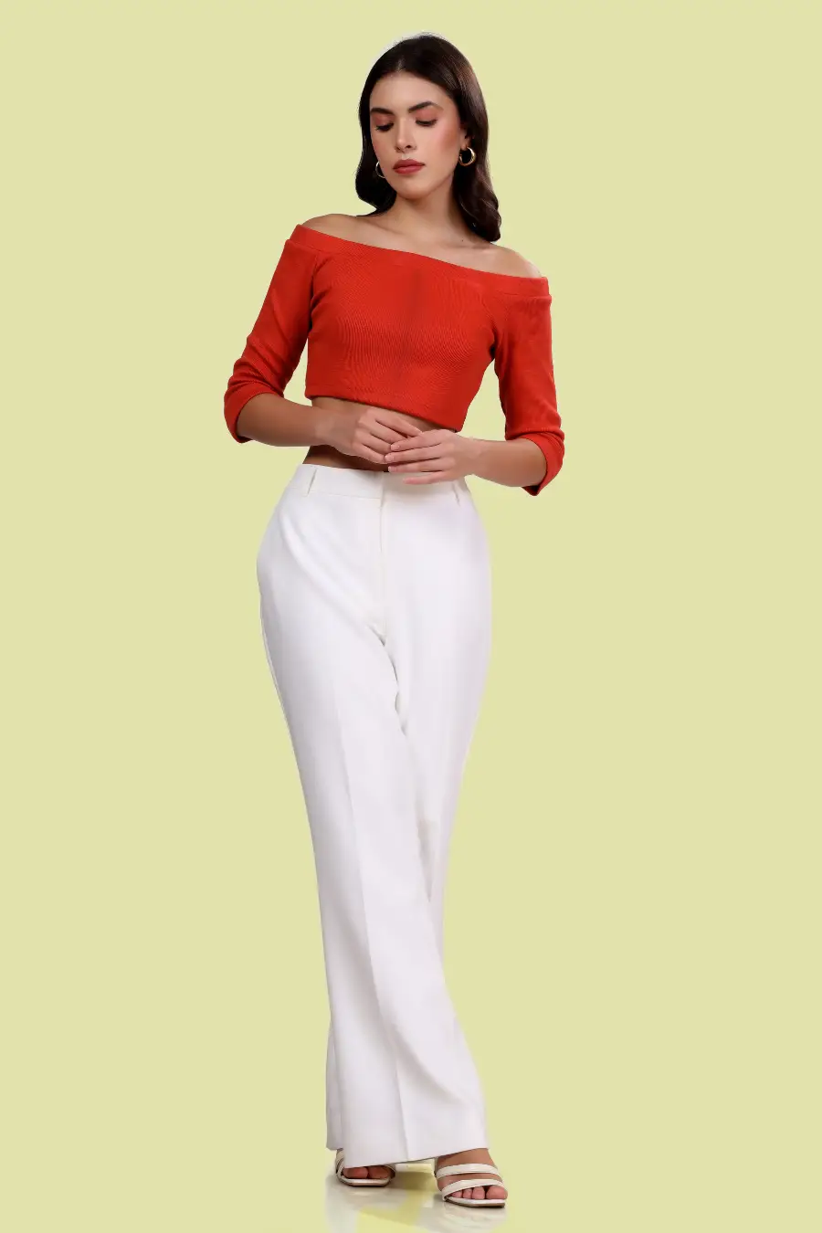 Front view of model wearing a red Off Shoulder Top, featuring an elegant off-shoulder design and fitted bodice