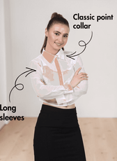 Model wearing white cropped shirt with classic collar and long sleeves