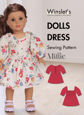 Doll dress sewing pattern for Millie with floral fabric and puff sleeves