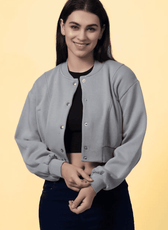 Model wearing a handmade bomber jacket using the 'Raya' sewing pattern, featuring ribbed cuffs, snap buttons, and a cropped fit.