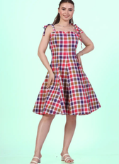 Model wearing a sleeveless midi dress with adjustable tie-shoulder straps and a square neckline sewed with Winslet's patterns
