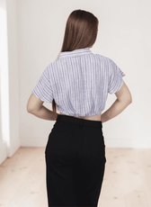 Close-up of blue striped shirt with button-up front and short sleeves