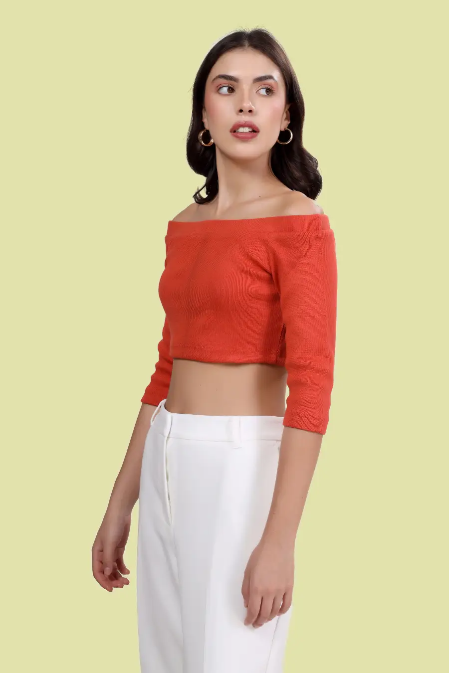 Side view of model wearing the 'Mia' Off Shoulder Top, featuring an elegant off-shoulder design and fitted bodice