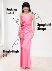 Back view of pink satin slip dress with spaghetti straps and high slit