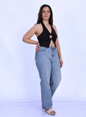 Model wearing the 'Winx' Halter Neck Top, a chic cut-out crop top with a flattering fit. Ideal for casual or evening wear, made from stretch fabric.