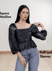 Women's black gathered peplum hem sewing pattern with smocked back and puff long sleeves, front view