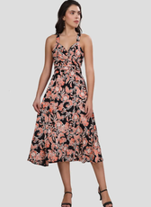 Full-length front view of the 'Camellia' wrap dress with a fitted bodice and flowing skirt. The floral print and wrap design offer a stylish look.