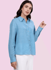 Close-up of the 'Hayden' oversized shirt in light blue. Showcasing button-down front, structured collar, and relaxed fit for a stylish, modern look.