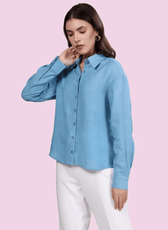 Side view of the 'Hayden' oversized shirt sewing pattern. Features a relaxed fit, long sleeves with buttoned cuffs, and a curved hemline for versatility.