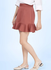 Close-up of the frill skirt made from the 'Buttercup' sewing pattern. Showcasing the structured fit, flared hem, and elegant fabric drape.