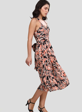Side angle of the 'Camellia' wrap dress displaying its flattering fit and wrap-around waist tie. The lightweight fabric drapes beautifully.
