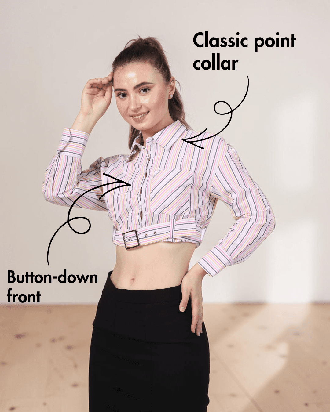 Close-up of women's plaid belted cropped shirt with collar, buttons, and belt detail
