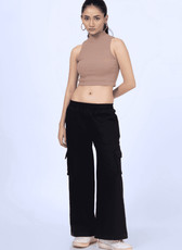 Model wearing black Y2K sweatpants made using the 'Maddie' sewing pattern. Features wide-leg fit, cargo pockets, and an elastic waistband for comfort.