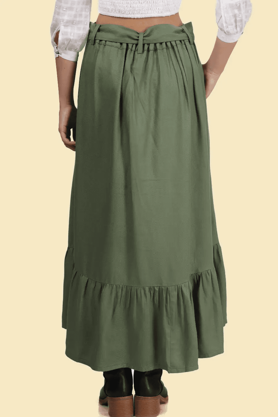 Back view of a tiered maxi skirt with a gathered waistband and ruffled hem. The flowy design offers comfort and elegance.