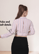 Back View of women's plaid belted cropped shirt with collar, buttons, and belt detail