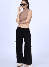Trendy Y2K sweatpants styled with sunglasses, showcasing the 'Maddie' sewing pattern. A relaxed fit with cargo pockets and an elastic waistband.