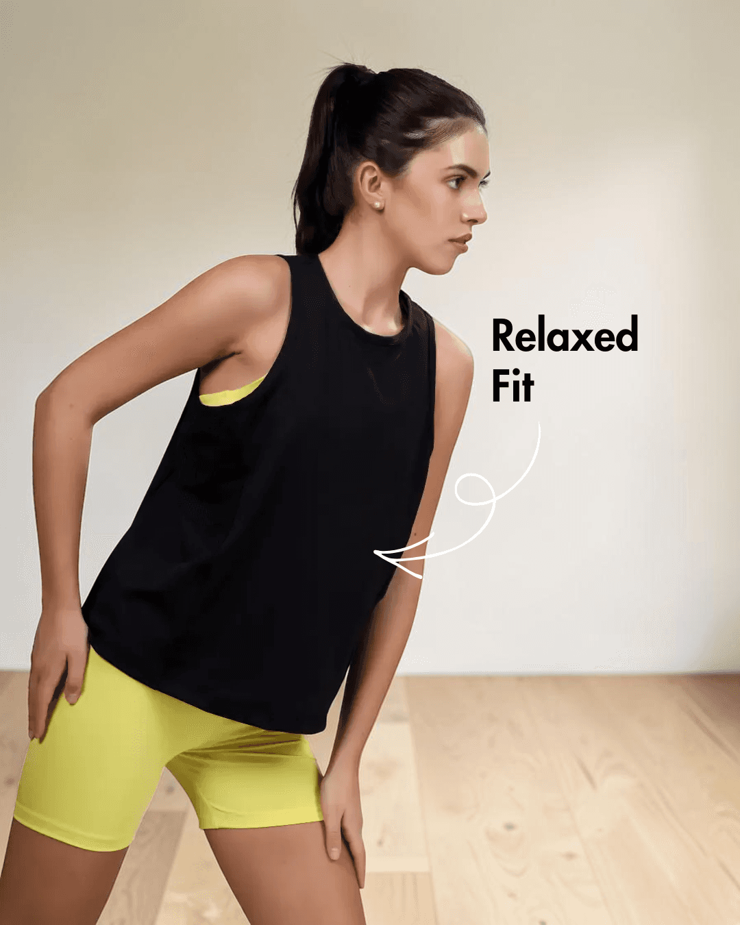 Close-up of model in black sleeveless tank top with high neckline, highlighting pattern details and relaxed fit of 'Tracy' sewing pattern