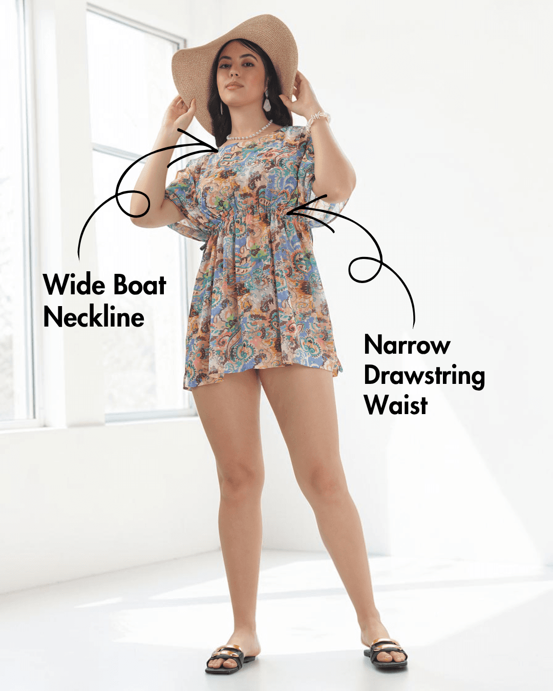 Model wearing colorful kaftan with wide boat neckline and soft short sleeves