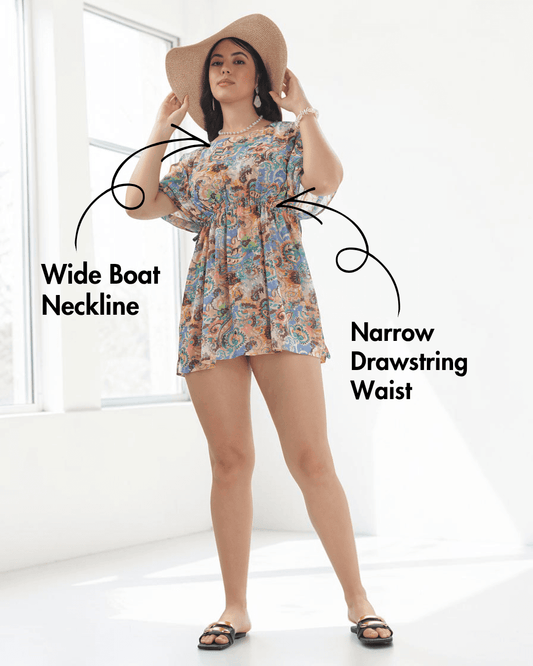 Model wearing colorful kaftan with wide boat neckline and soft short sleeves