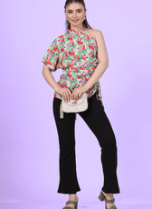 Front view of a model wearing the one shoulder kimono top paired with trousers