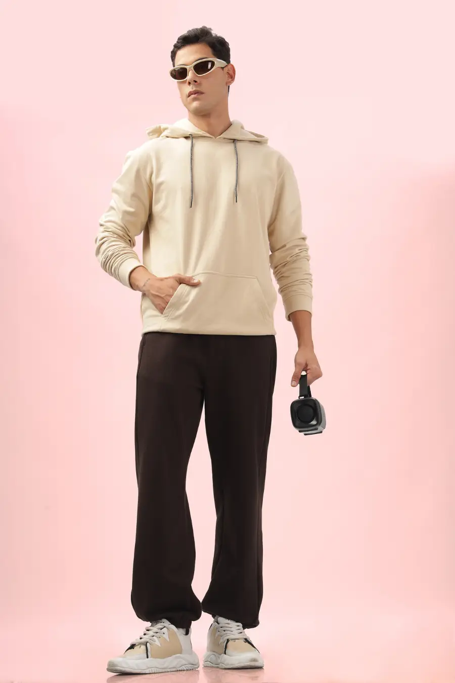 Model showcasing the 'Louis' men's joggers sewing pattern in a casual outfit. Perfect for everyday wear with a modern fit.