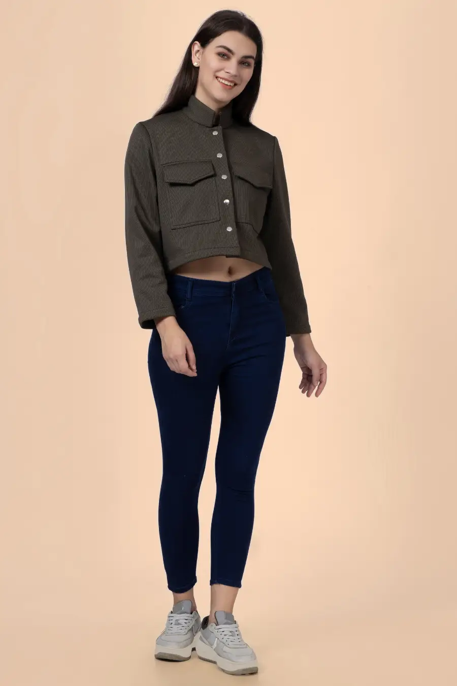 Model wearing a cropped utility jacket made using the 'Noelle' sewing pattern. Features a structured fit, button-front closure, and flap chest pockets.