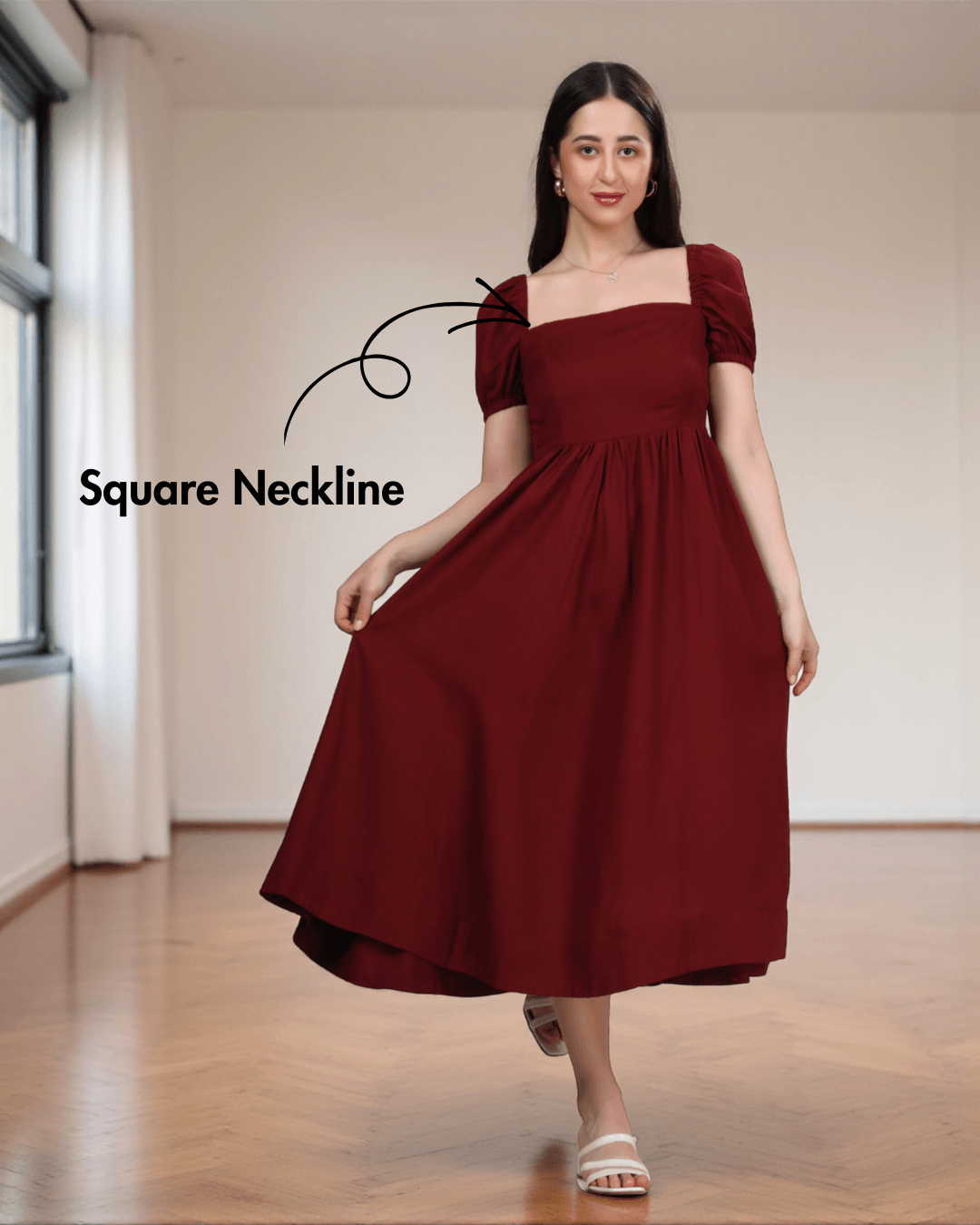 Model showcasing green smocked back panel long dress with puff sleeves