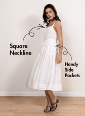 Model wearing white sundress with square neckline, adjustable straps, and side pockets, showcasing the Fiona sewing pattern