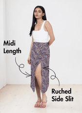 Model wearing midi skirt with side slit and patterned fabric