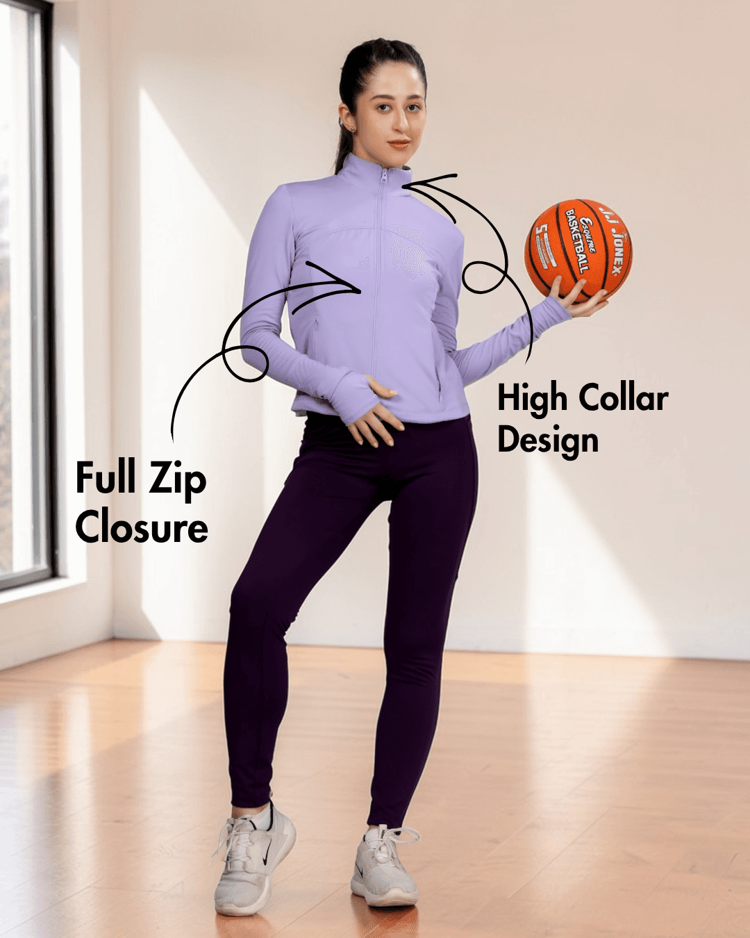 Close-up of women's purple sports jacket with high collar and full zip closure