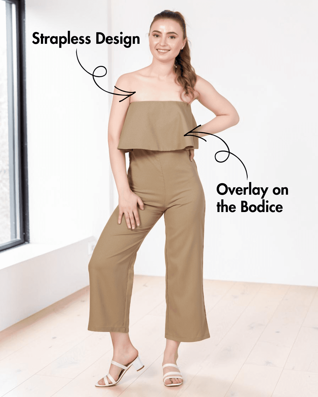Model wearing beige strapless jumpsuit sewing pattern with overlay and straight-leg design