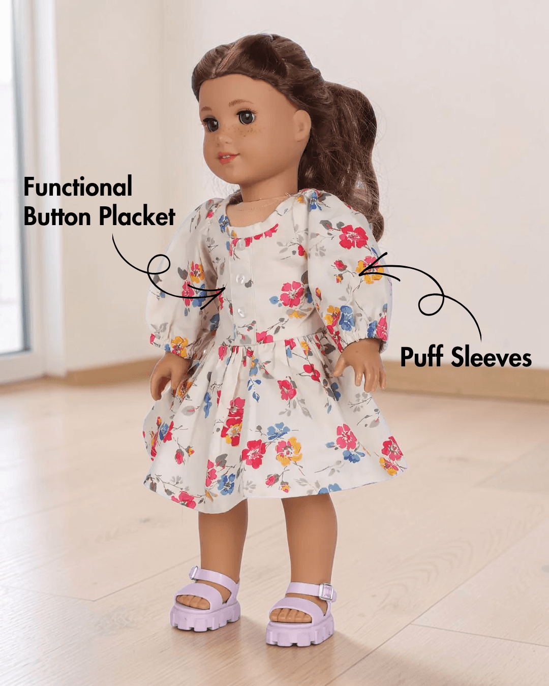 Side view of doll Millie in floral dress with elastic shirring and puff sleeves