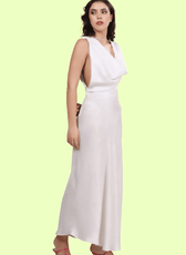 Side view of a model wearing backless cowl neck gown