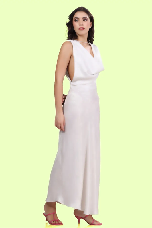 Side view of a model wearing backless cowl neck gown