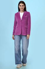 Model wearing the Monroe blazer with a casual outfit, showcasing its adaptability for different styles. A beginner-friendly sewing pattern with detailed instructions.