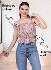 Close-up of pink ruffle top pattern details with textured fabric and feminine design