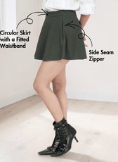 Model wearing green skater skirt with side seam zipper and fitted waistband