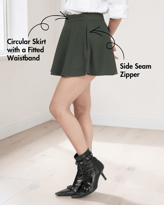 Model wearing green skater skirt with side seam zipper and fitted waistband