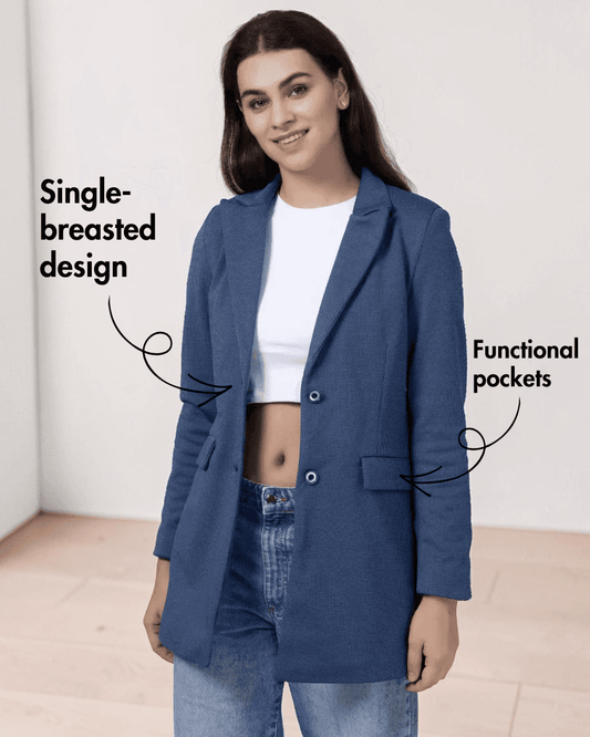 Model wearing blue blazer with single-breasted design, structured shoulders, and functional pockets