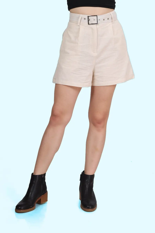 Close-up of beige high-waisted shorts with a tailored fit, pleats, and a coordinating belt. Designed for a flattering silhouette and structured look.