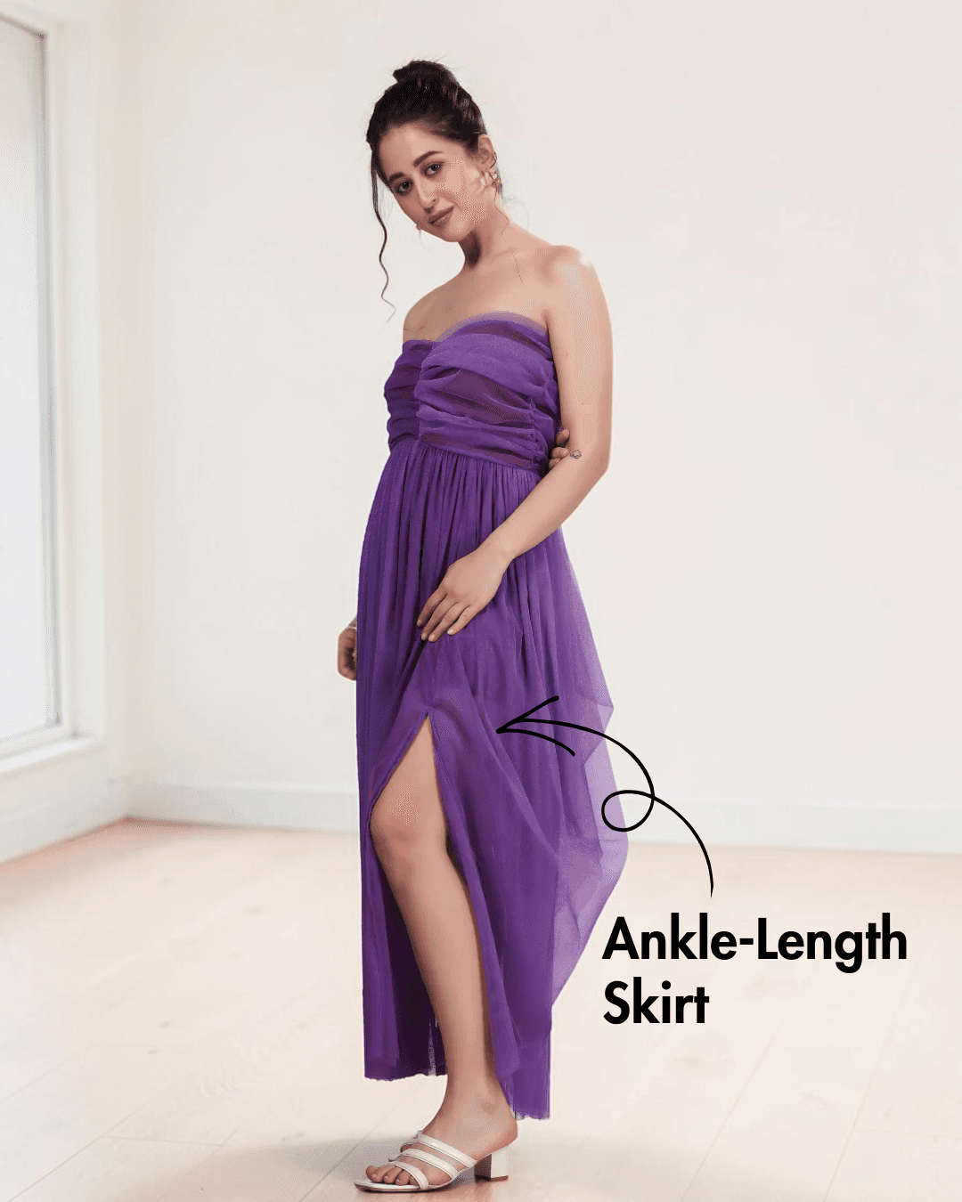 Purple strapless gown with ankle-length slit and invisible zip closure