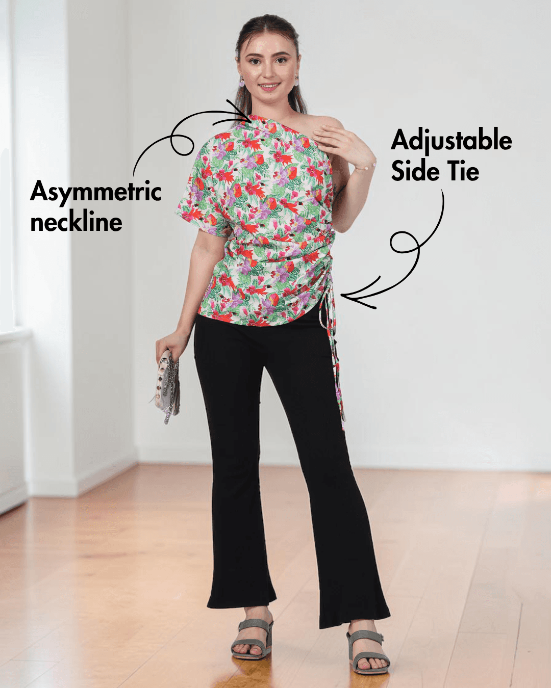 Model wearing floral one shoulder kimono top with adjustable side tie, black pants, and heels, sewing pattern for women