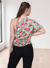 Back view of floral one shoulder kimono top with asymmetric neckline, side tie detail, and pattern design
