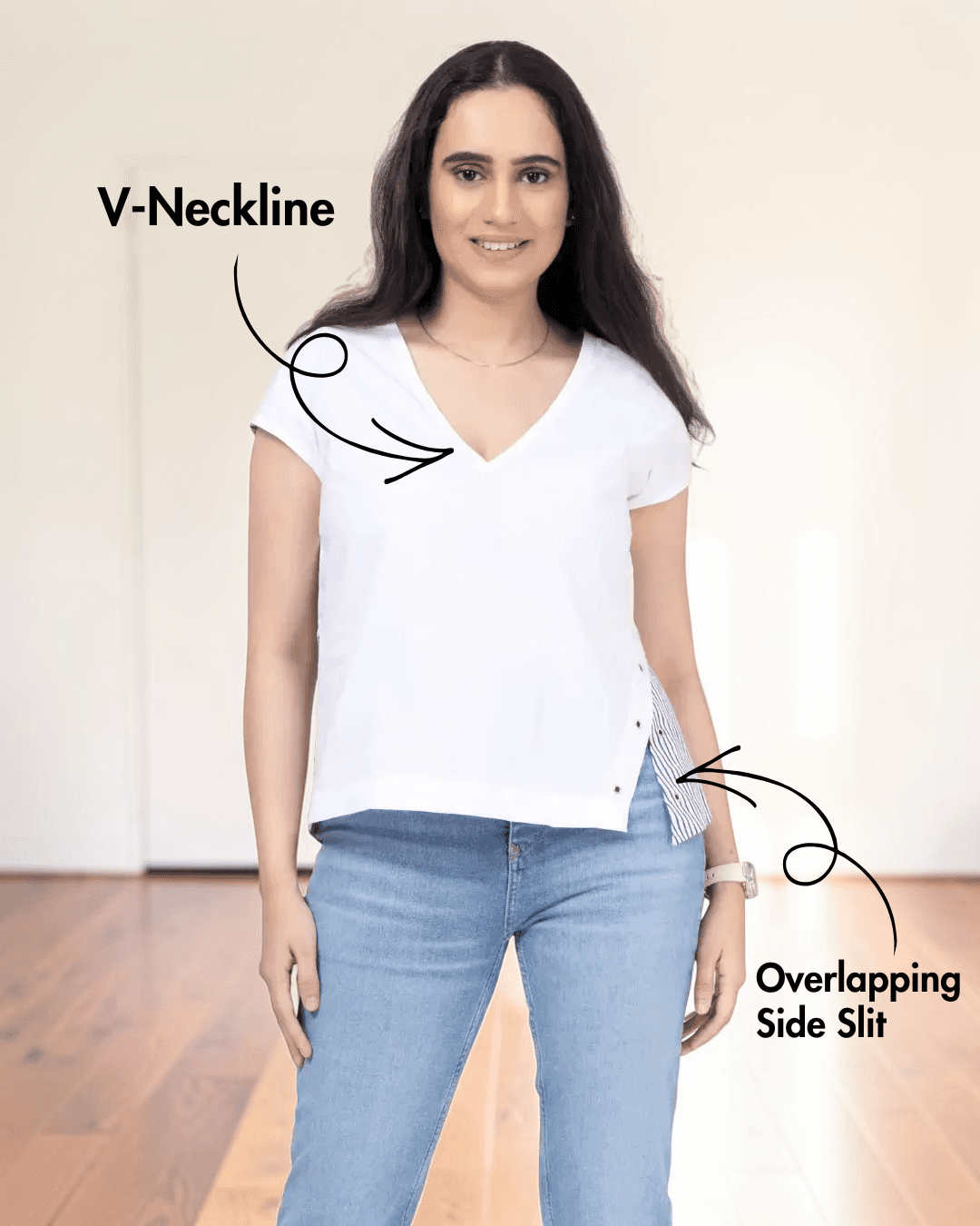 Woman wearing white V-neck relaxed top with side slit, sewing pattern details