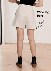 Back view of High waisted shorts sewing pattern 'Bailey' with front pleats and wide leg hem