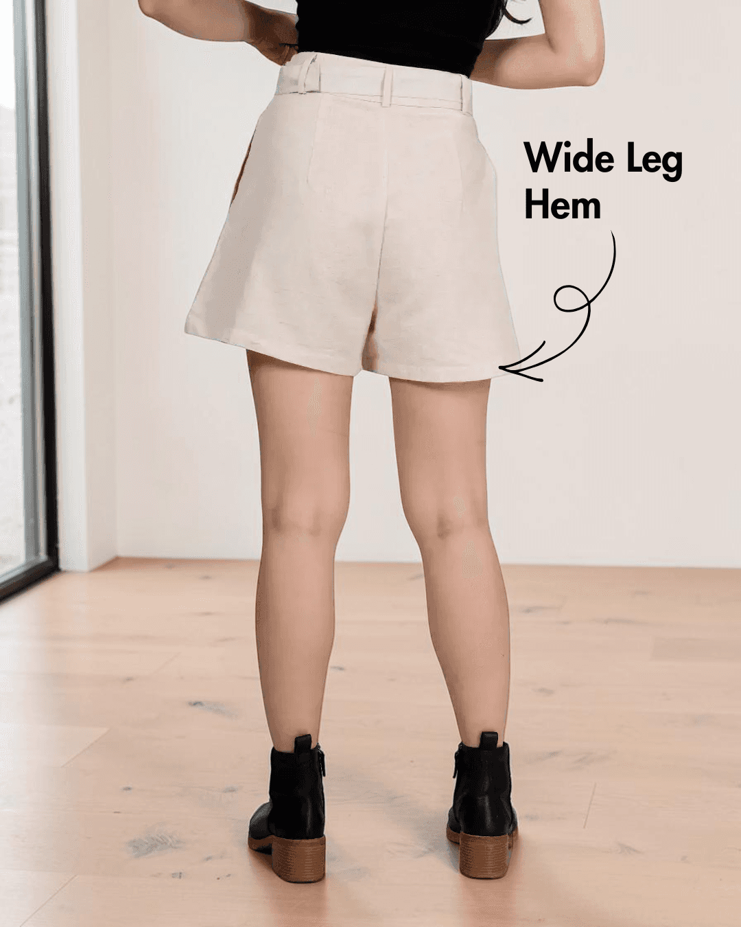Back view of High waisted shorts sewing pattern 'Bailey' with front pleats and wide leg hem