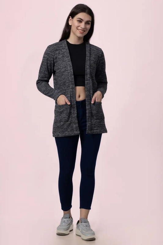 Model wearing a long open-front cardigan made using the 'Nora' sewing pattern. Features a relaxed fit, long sleeves, and front pockets for a stylish layering option.